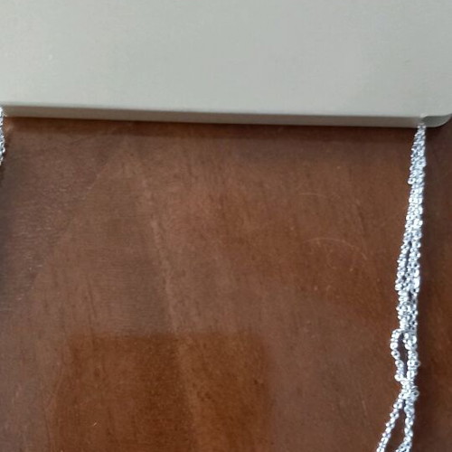 Necklace new with 3 chains and 1 clasp in silver color