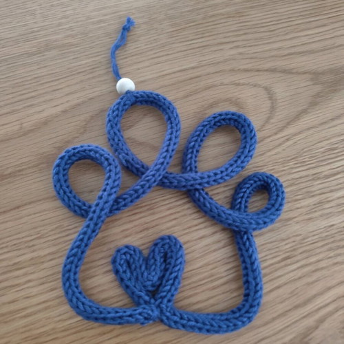Knitted decorative paw with heart new, handmade