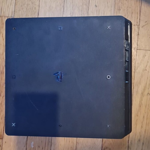 PlayStation 4 Slim 500GB console with controller, HDMI and power cable