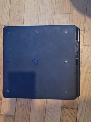 PlayStation 4 Slim 500GB console with controller, HDMI and power cable