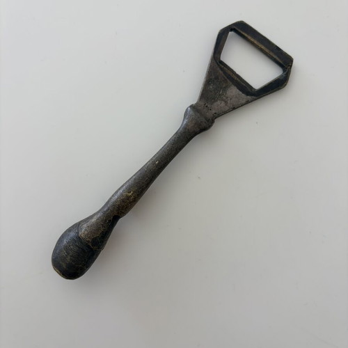 Brass beer opener with horse leg and horseshoe end used