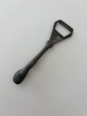 Brass beer opener with horse leg and horseshoe end used