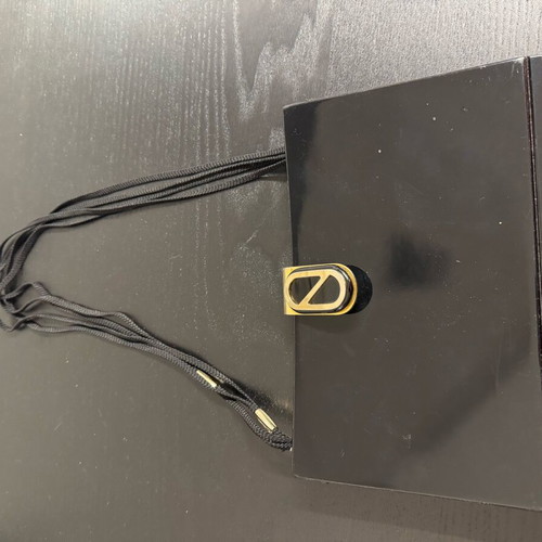 Clutch used with tortoiseshell and leather interior