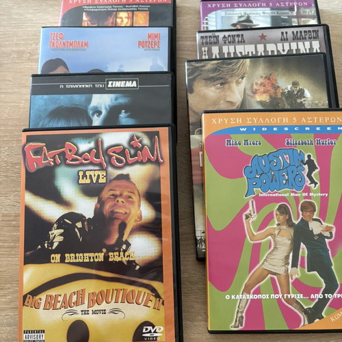DVD pack of 8 movies including Fat Boy Slim Big Beach Boutique II and Austin Powers