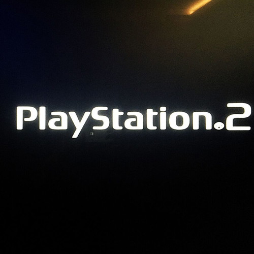 Playstation 2 Slim like new with steering wheel and 3 games