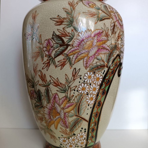 Tall decorative vase with intricate floral designs like new