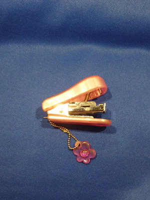 Small pink children's stapler used