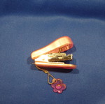 Small pink children's stapler used