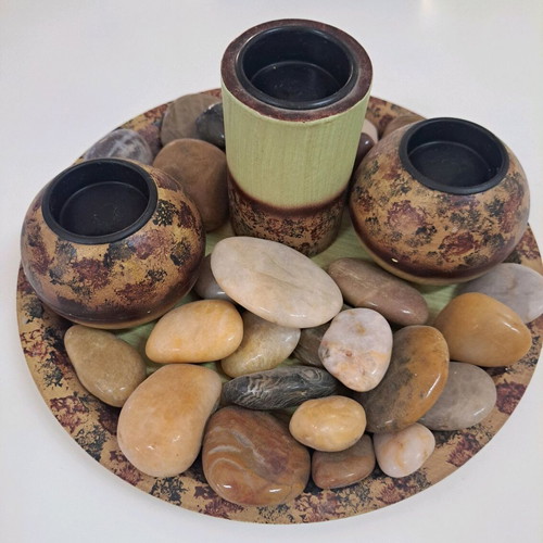 Tray with wooden candlesticks and colorful stones like new