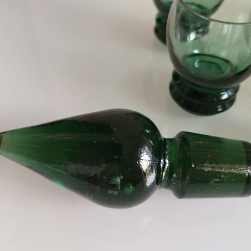 Vintage decanter set with 5 green glass shot glasses used