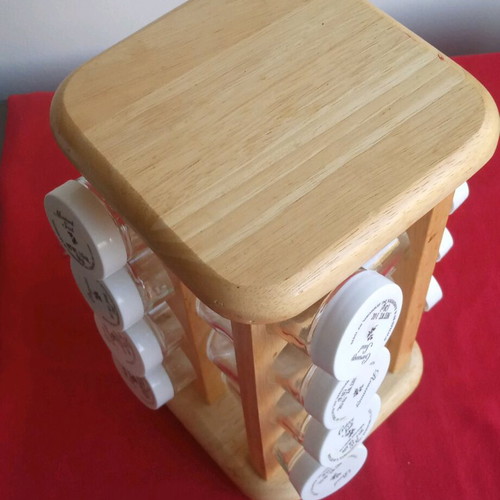 Spice jars used in wooden rotating rack with 16 glass containers