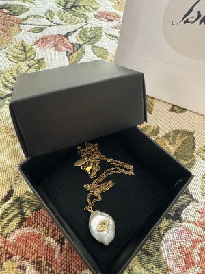 Necklace chain with eye and white stone new, gold color