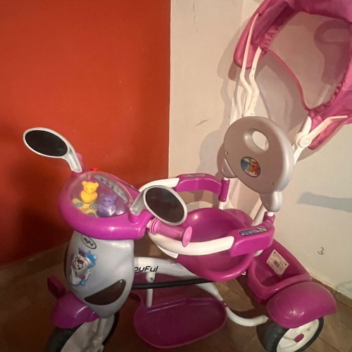 Tricycle like new with canopy, footrest and safety bar