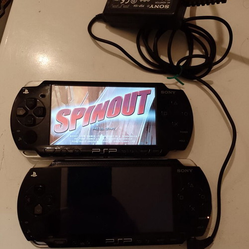 PlayStation Portable (PSP) used, 2 devices with original charger