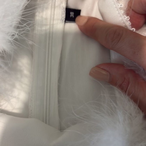 Strapless mini dress used, white with feathers