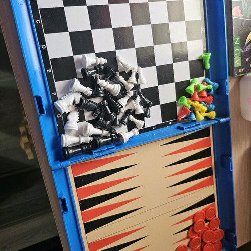 Portable multiple board game like new, closes like a suitcase
