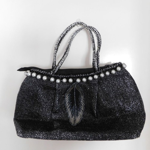 Handheld straw bag metallic like new with feather design and pearl accessory