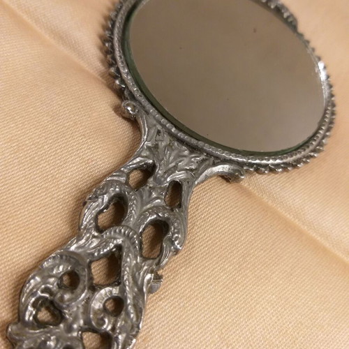 Carved old hand mirror used