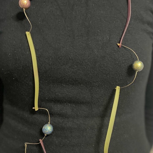 Long necklace used with gold-plated multicolor beads and plastic parts