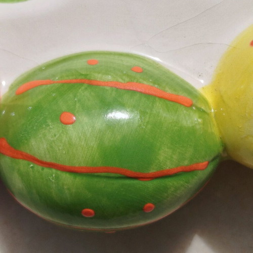 Chicken egg holder with colorful eggs in porcelain new for festive table