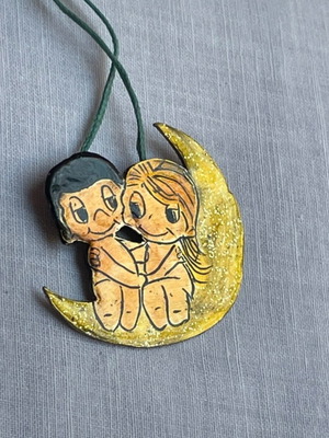 Love is… necklace metal with glossy varnish like new