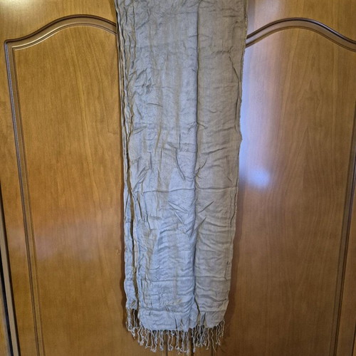 Scarf used in brown and beige tones with fringed edges
