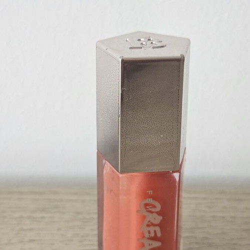 Fenty Beauty Mini Lip Gloss coral shade, almost full