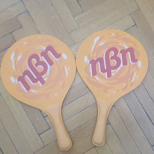 Wooden rounded beach paddles, orange