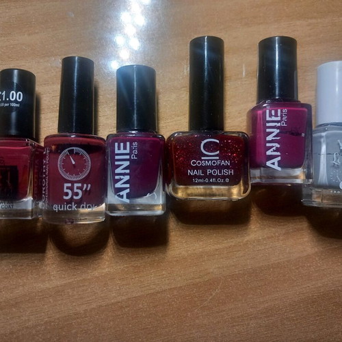 Mano nail polish used in red, purple and gray shades