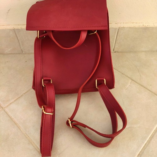 Red backpack used with broken zipper and mark