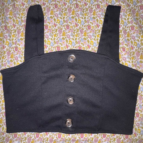 Black sleeveless shirt used with buttons, size M