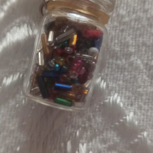 Keychain in glass jar with colorful beads like new