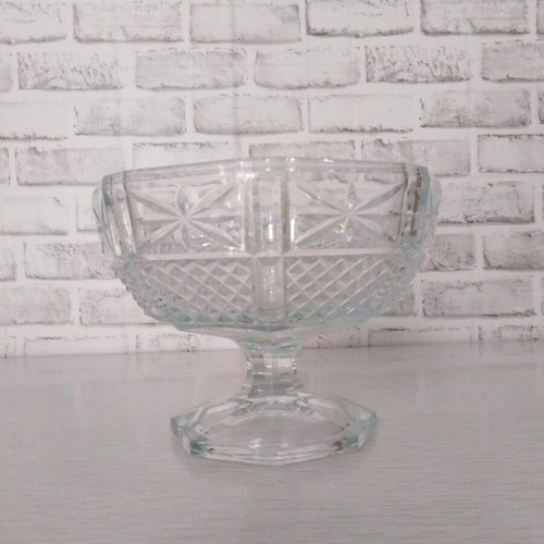 Vintage glass fruit bowl on foot with embossed diamond design