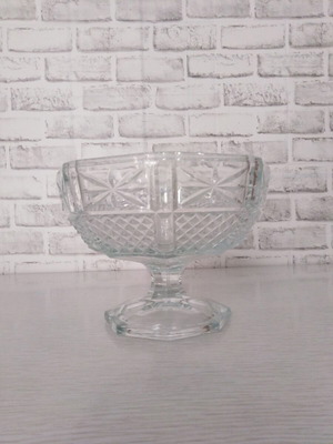 Vintage glass fruit bowl on foot with embossed diamond design