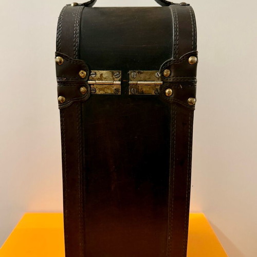 Decorative wooden case used with leatherette for bottle storage