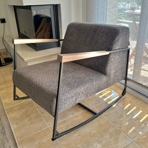 Rocking armchair with grey boucle fabric
