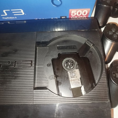 PS3 Super Slim 12GB console with 4 games and 3 controllers