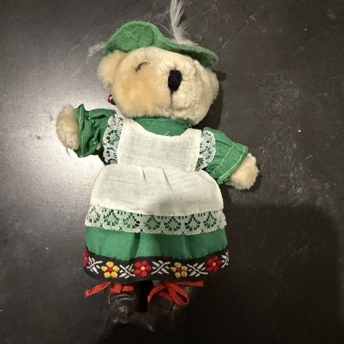 Small plush teddy bear with traditional costume used