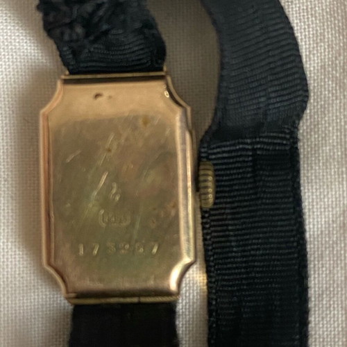 Vintage women's wristwatch used with 14K gold and black strap
