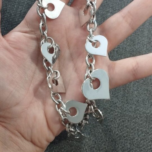 Charm bracelet with double chain and hanging hearts, like new, silver-tone