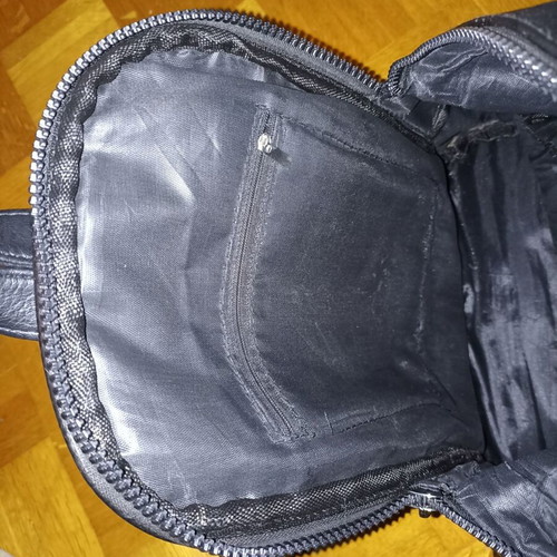 Backpack black leather type used with multiple pockets