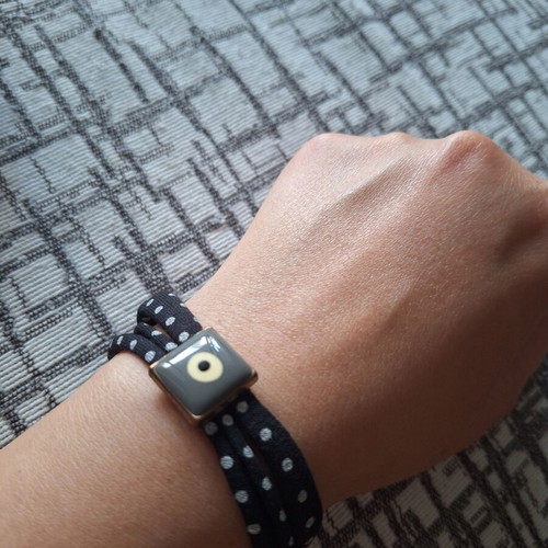 Fabric bracelet with eye pattern like new, black and grey