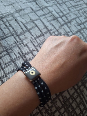 Fabric bracelet with eye pattern like new, black and grey