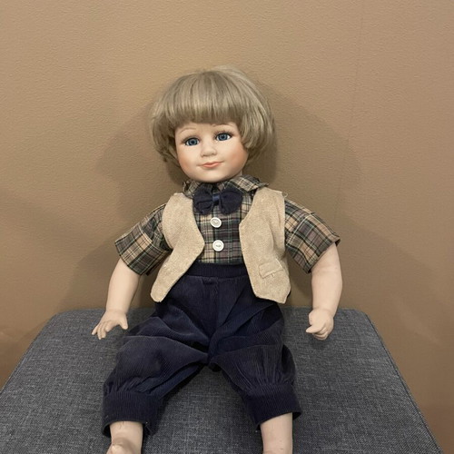 Porcelain collectible boy doll like new, 43 cm tall with fabric clothes