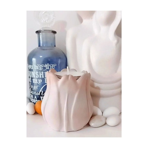 Handmade ceramic tulip-shaped tealight holder in pastel pink ombre