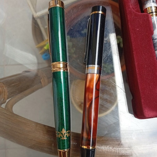 Pens in like-new condition with various designs