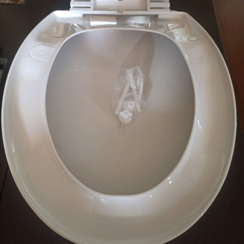 Plastic toilet seat new with screws