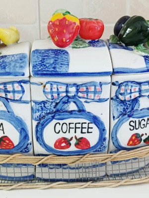 Ceramic jar set in wire basket like new