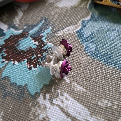 Rose shaped earrings purple used