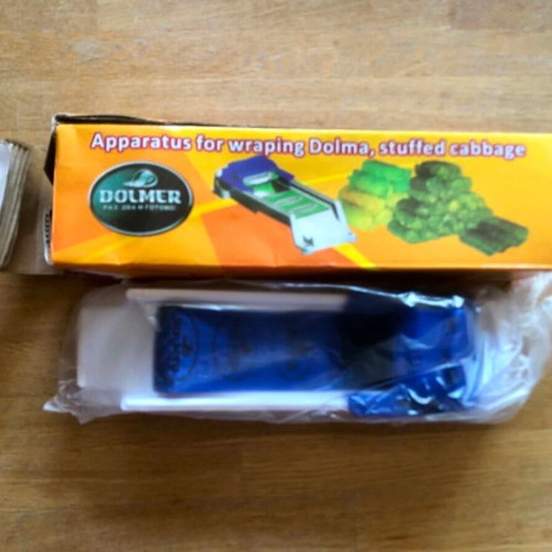 Dolmadoparaskevastis new, wrapping device for dolmades or stuffed cabbage